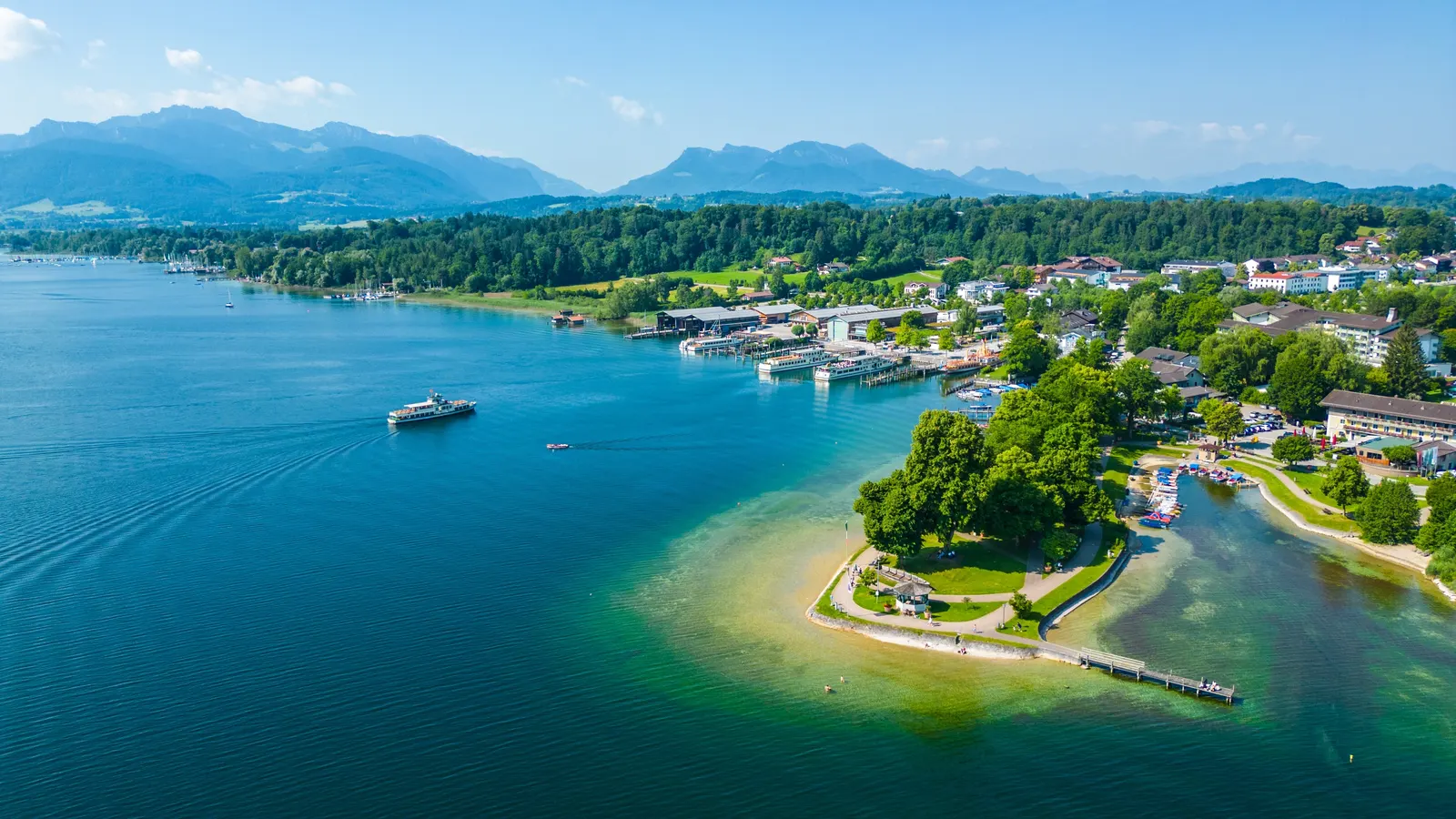 Aerial view of Prien am Chiemsee with harbour, lakeside park and the Chiemgau Alps
